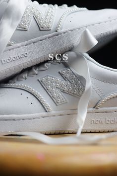 the new balance sneakers are adorned with swaroes