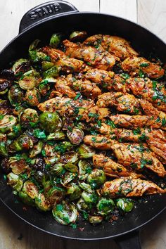 chicken and brussel sprouts in a skillet