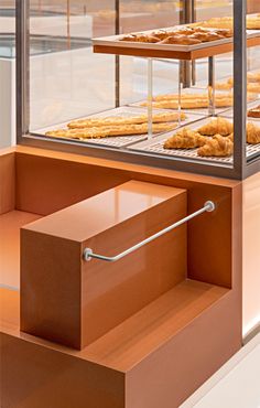 an assortment of baked goods in a display case