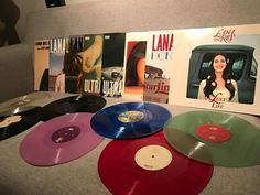 various colored vinyl records are on display