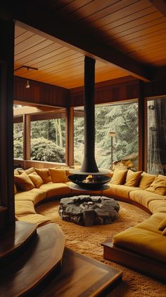 a living room filled with lots of furniture and a fire place in the middle of it