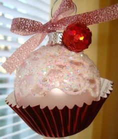 a cupcake ornament hanging from a window