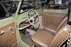 the interior of an old car with leather seats