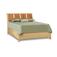 a wooden bed frame with green sheets and pillows on it's headboard, in front of a white background