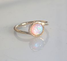 Beautiful gold filled ring with white opal gemstone.White shiny opal stone on a dainty hammered gold filled ring.Super dainty style- chic and beautiful.The price for this 1 ring !!!!Also available with blue opal.Stone size 6 mm Please pick your size ring! Mermaid Rings, White Gold Opal Ring, Rings Opal, Black Hills Gold Jewelry, Rings Etsy, White Opal Ring, Body Chains, Opal Ring Gold, Ring Stacking