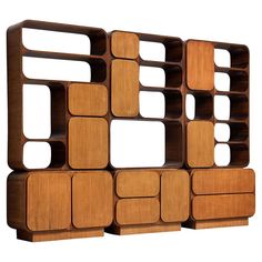 a wooden shelf that has several compartments on it