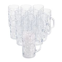 a bunch of clear glass mugs are lined up in the shape of a heart