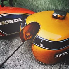 two orange and black kettles sitting next to each other