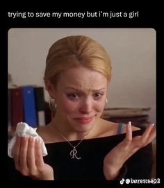 a woman holding something in her hand and saying, trying to save money but i'm just a girl