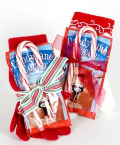 two candy canes wrapped in red and white paper