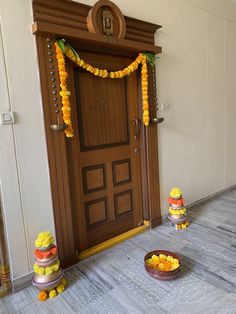 an entrance decorated with flowers and garlands