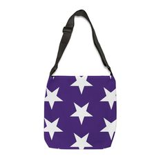 a purple and white bag with stars on the front, one shoulder strap is hanging down