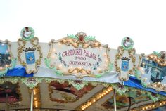 the carousel is decorated with colorful lights and decorations