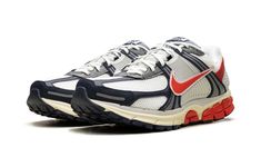 The Nike Zoom Vomero 5 "USA" is a patriotic colorway of the retro running and lifestyle shoe.  The Nike Zoom Vomero 5 debuted in 2010 and was later part of the popular Y2K sneaker trend in the 2020s.  Here, on the “USA” colorway, the shoe sports the colors of the American Flag: red, white, and blue.  Specifically, the upper features a Summit White mesh base and Navy leather overlays.  A Picante Red Swoosh can be found on both sides, while more red accenting appears on the heel overlay and on the heel of the rubber outsole.  Classic “Nike Zoom Vomero 5” detailing is located on the tongue tag.  A cream midsole gives the shoe an aged look.  Release date: June 29, 2024 Nike Zoom Vomero 5, Zoom Vomero 5, Usa Shoes, Vomero 5, Sneaker Trend, Stadium Goods, Trending Sneakers, Navy Leather, White Mesh