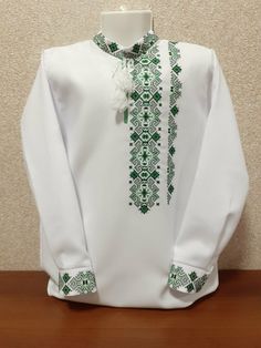 Ukrainian Folk Tradition Embroidered Shirt for men Cross stitch Size 2XS-4XL Very beautiful white embroidered shirt with long sleeves for men. Material cotton, embroidery cross. Perfectly complements your wardrobe. Beautiful and original gifts. Size: XS-4XL Main characteristics: Fabric  - cotton Color fabric - white Technique - cross-stitch When ordering please tell me the volume of the chest, waist and hips. We will choose the right size for you! Made in Ukraine! Finishing and decoration embroi Embroidery Jacket Design, Cross Stitch Jacket, White Cotton Shirt With Embroidered Cuffs, White Long Sleeve Shirt With Machine Embroidery, Traditional Fit White Top, Traditional Cotton Tops With Embroidered Cuffs, Traditional White Tops, Traditional White Top, Traditional Green Cotton Shirt