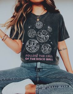 Get your vibes flowing with this disco ball t-shirt! Designed by me here at FloraMira, the retro aesthetic is a must have in any closet. Perfect for a disco bachelorette, gift for your bestie, or yourself! ★ Though these shirts are a roomier fit, sizing up 1-2 sizes gives you that true 'oversized' look if that's what you're going for. you like your shirts more form fitting, I recommend sizing down. The size chart is there to help you, but please message me if you have any questions! ★ Printred on Comfort Colors adult Tshirt. These shirts are super soft and comfortable, a favorite amongst my customers! ★ Printed apparel can be machine-washed cold, INSIDE OUT on a gentle cycle with a mild detergent and like colors to preserve the print. Hang dry if possible, if not possible please dry inside Disco Cowgirl Party T-shirts & Tank Tops, Disco Bachelorette, Disco Cowgirl, Bachelorette Gift, Disco Shirt, Cowgirl Shirts, Oversized Look, Shirt Y2k, Disco Outfit