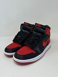 ad eBay - 

The Air Jordan 1 Retro OG 2023 High Satin Bred W is a women's athletic sneaker with a high top shoe shaft style, red satin upper material, and a black and red colorway. It has a style code of FD4810-061 and a US shoe size of 9.5. The shoe is designed for boxing performance and is part of the Air Jordan product line. It comes brand new with the original box. Red Sole High-top Sneakers For Training, Red-sole High-top Training Sneakers, High Top Shoe, Air Jordan 1 Retro, Jordan 1 Retro, Red Satin, Athletic Sneakers, Air Jordan 1, Athletic Women