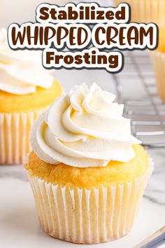 two cupcakes with frosting on top sitting on a cooling rack next to the words, stabilized whipped cream frosting