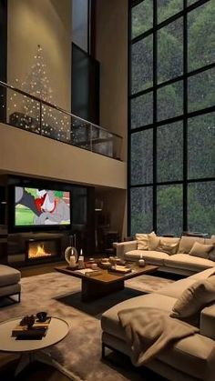 a living room filled with furniture and a flat screen tv mounted to the side of a wall