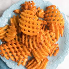 some waffles are on a blue plate