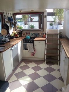 the kitchen is clean and ready for us to use in this houseboating trip