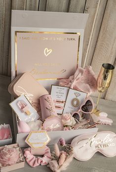 a box filled with pink and gold items