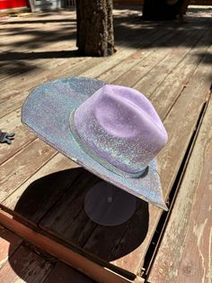 "Blue, purple, pink, black, or iridescent purple cowboy cowgirl hat with rhinestones on top and stars on the bottom of the brim. This is one size fits most, there's a drawstring to adjust sizing.  ships in 2 business days! Stunning in person  Perfect for Coachella , stagecoach, Nashville, country concerts, bachelorette parties, brides, weddings Please note that the hats are handmade and may have some variances and blemishes. If any, they are very minor . The hats might have a bit of \"stickiness Adjustable Western Purple Hat, Purple Wide Brim Hat For Festival, Purple Wide Brim Festival Hat, Cowgirl Hat With Rhinestones, Purple Cowboy Hat, Rhinestone Cowboy Hat, Queen Of Hearts Halloween, Texas Cowgirl, Nashville Country