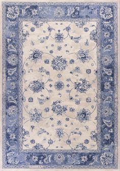 a blue and white rug with flowers on it