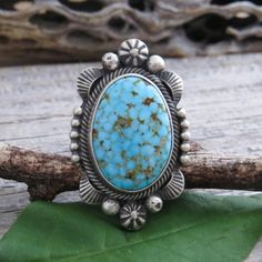 This Unique, Native American Navajo Kingman Turquoise Ring Is Set In A Detailed, Symmetrical, Sterling Silver Setting That Really Highlights This Turquoise Stone. Handmade By Eli Skeets, This One Of A Kind, Gemstone Ring Will Make You Stand Out. Show Off Your Love For Authentic, Native American Handmade Turquoise Jewelry That Is A Work Of Wearable Art And Will Last A Lifetime. Size 6 3/4 Sterling Silver Signed: Eli Skeets, Native American Navajo Artist Measures: 1 7/16" By 7/8" Weight: 15 Grams Collectible Turquoise Cabochon Ring, Traditional Blue Turquoise Ring In Sterling Silver, Western Style Blue Turquoise Ring In Sterling Silver, Western Style Blue Turquoise Sterling Silver Ring, Sterling Silver Turquoise Ring Collectible, Sterling Silver Turquoise Ring For Collectors, Western Style Blue Sterling Silver Ring, Collectible Sterling Silver Turquoise Ring, Western Style Collectible Turquoise Ring