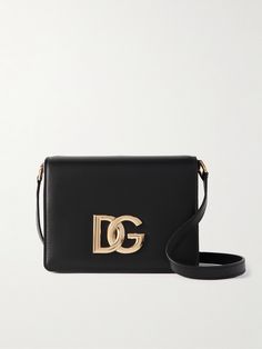 Dolce&Gabbana's bag is part of the '3.5' collection - each style is embellished with a gold-tone 'DG' logo. Defined by a small but structured shape, it's been made in Italy from smooth leather and has an adjustable strap, so you can wear it cross-body. Inside, you'll find an organized interior with slots for your cards and enough space for your phone, lipstick and mints. Designer Shoulder Bag With Brass Hardware, Chic Rectangular Bag With Gold-tone Logo Plaque, Designer Evening Shoulder Bag With Brass Hardware, Designer Shoulder Bag With Gold-tone Logo Plaque, High-end Evening Bag With Gold-tone Logo Plaque, Designer Formal Bag With Gold-tone Logo Plaque, Designer Formal Bags With Gold-tone Logo Plaque, High-end Evening Bags With Gold-tone Logo Plaque, Designer Evening Bag With Metal Logo