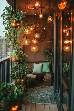 a balcony with plants and lights hanging from the ceiling