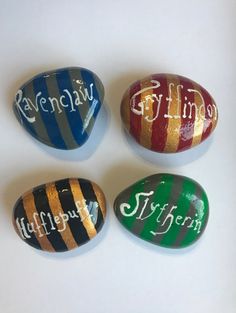 four painted rocks with different names on them