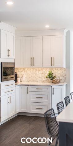 the kitchen is clean and ready for us to use as a dining room or office