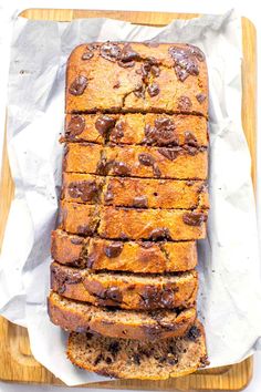 a loaf of chocolate chip banana bread on a cutting board