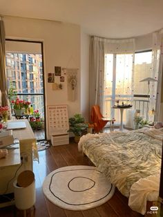 a bed room with a neatly made bed and lots of plants on the windowsill