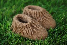 a pair of shoes that are in the grass