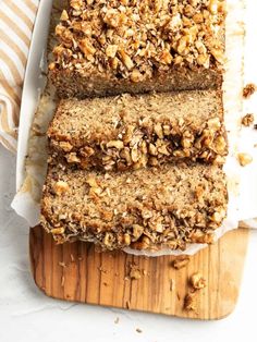 three slices of banana nut bread on a cutting board