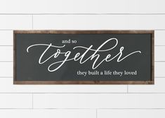 a sign that says and so together they built a life they loved on the wall