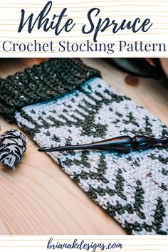 the white space crochet stocking pattern is laying on top of a wooden table