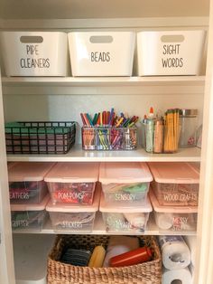 an organized pantry with plastic bins and baskets on the shelves, labeled with words