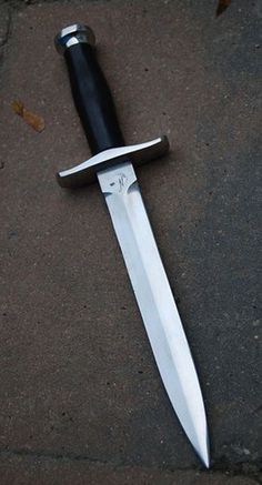 a knife that is laying on the ground