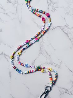 Fun and happy lanyard perfect for teachers or nurses. Trendy Multicolor Lanyards For Gifts, Trendy Multicolor Lanyards As Gifts, Multicolor Personalized Lanyards With Round Beads, Personalized Multicolor Lanyards With Round Beads, Teacher Lanyard Ideas, Beaded Lanyards Diy, Clay Bead Lanyard, Beaded Keyrings, Teacher Lanyard Beaded