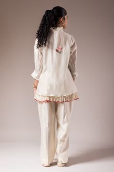 White shirt style top with pleated collar and maala style embroidery. Paired with a small cotton crushed inner and cotton flared pant. - Aza Fashions Cotton Blouse With Embroidered Cuffs For Work, Cotton Blouse With Embroidered Cuffs, Elegant Cotton Pant Set With Floral Embroidery, Cotton Pant Set With Chikankari Embroidery And Long Sleeves, Elegant Cotton Pant Set With Chikankari Embroidery, Embroidered Cotton Pant Set With Long Sleeves, Cotton Top With Embroidered Cuffs For Work, Cotton Tops With Embroidered Cuffs For Work, White Cotton Sets With Embroidered Hem