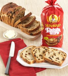 bread and butter on a table with a bag of sun - map raisin bread