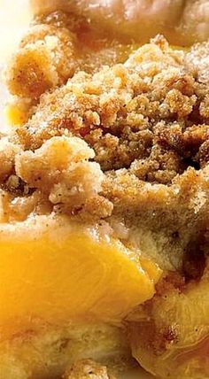 a close up of a piece of food on a plate with bread crumbs