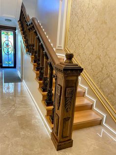 the stairs are made of wood and marble