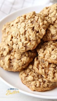 several oatmeal cookies on a white plate