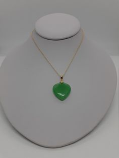 Green Jade Heart Charm pendant / Necklace, Love Jade in Gold Plated with chain. The vibrant green variations of Jade are a symbol of growth and vitality, which makes it a stone that stands for wealth and longevity. And it's not all about the Benjamin's, because when Jade instills prosperity in every aspect of your life, you lead a richer, more fulfilling existence. After all, money can only buy so much happiness. - Stone: Green Jade Heart. - Heart Measures: 22mm x 20mm. - Metal: Silver and Gold Green Heart-shaped Emerald Necklace For Gift, Heart-shaped Green Emerald Necklace As Gift, Heart-shaped Green Emerald Necklace For Gift, Green Heart Pendant Emerald Necklace As Gift, Green Emerald Heart Pendant Necklace As Gift, Green Emerald Heart Pendant Necklace For Gift, Green Teardrop Pendant Necklace For May Birthstone, Green Pendant Necklace For Valentine's Day, Green Heart Cut Necklace For Gift