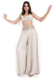 Off white georgette embroidered choli and tissue pant with mirror belt. Disclaimer: Since we are a made-to-measure brand and our dyeing process and embroidery are handcrafted, there may be slight variations in the color and embroidery of the actual product. The print placement may also vary from what is represented in the images shown on the product page. Mirror Belt, Rahul Khanna, Payal Singhal, Embroidered Pants, Nehru Jackets, Western Wedding, Print Placement, Wedding Service, Dyeing Process