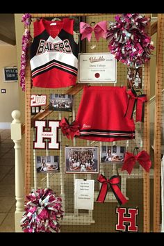 a display case with cheerleaders and ribbons on it